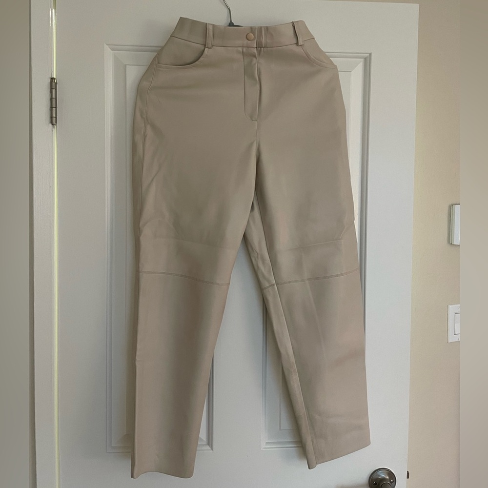 Cream leather pants.